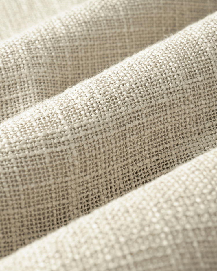 Close-up of Jupiter custom linen look sheer curtain fabric, highlighting its soft, heavyweight texture and detailed weave.
