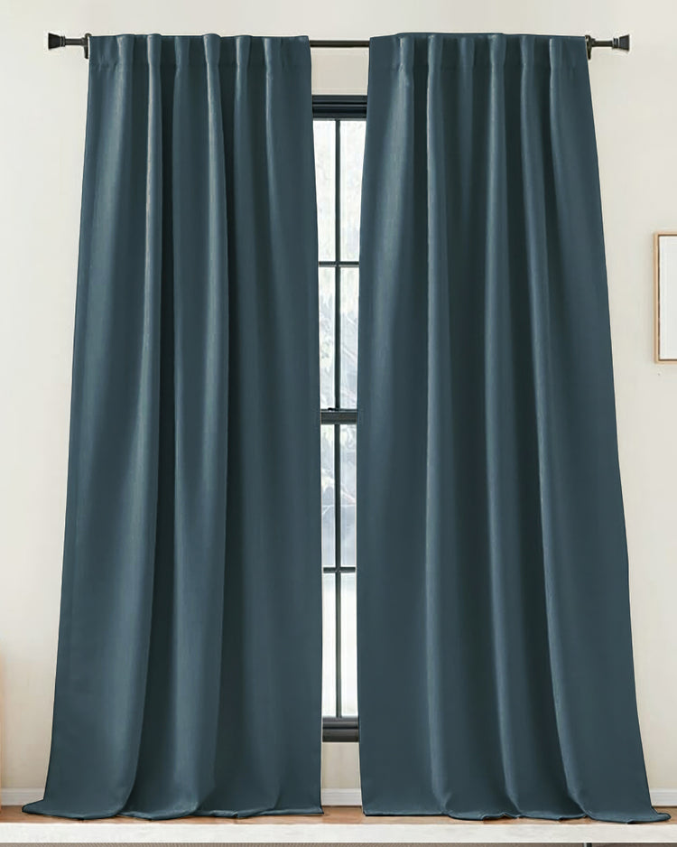 Pair of long teal Zoe custom drapery panels with a linen-look fabric, showcasing a soft pinch pleat header and tailored window treatment.