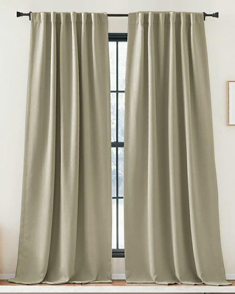 Soft, custom-made Zoe linen look curtains in a natural color, elegantly covering a window for privacy and refined home decor.