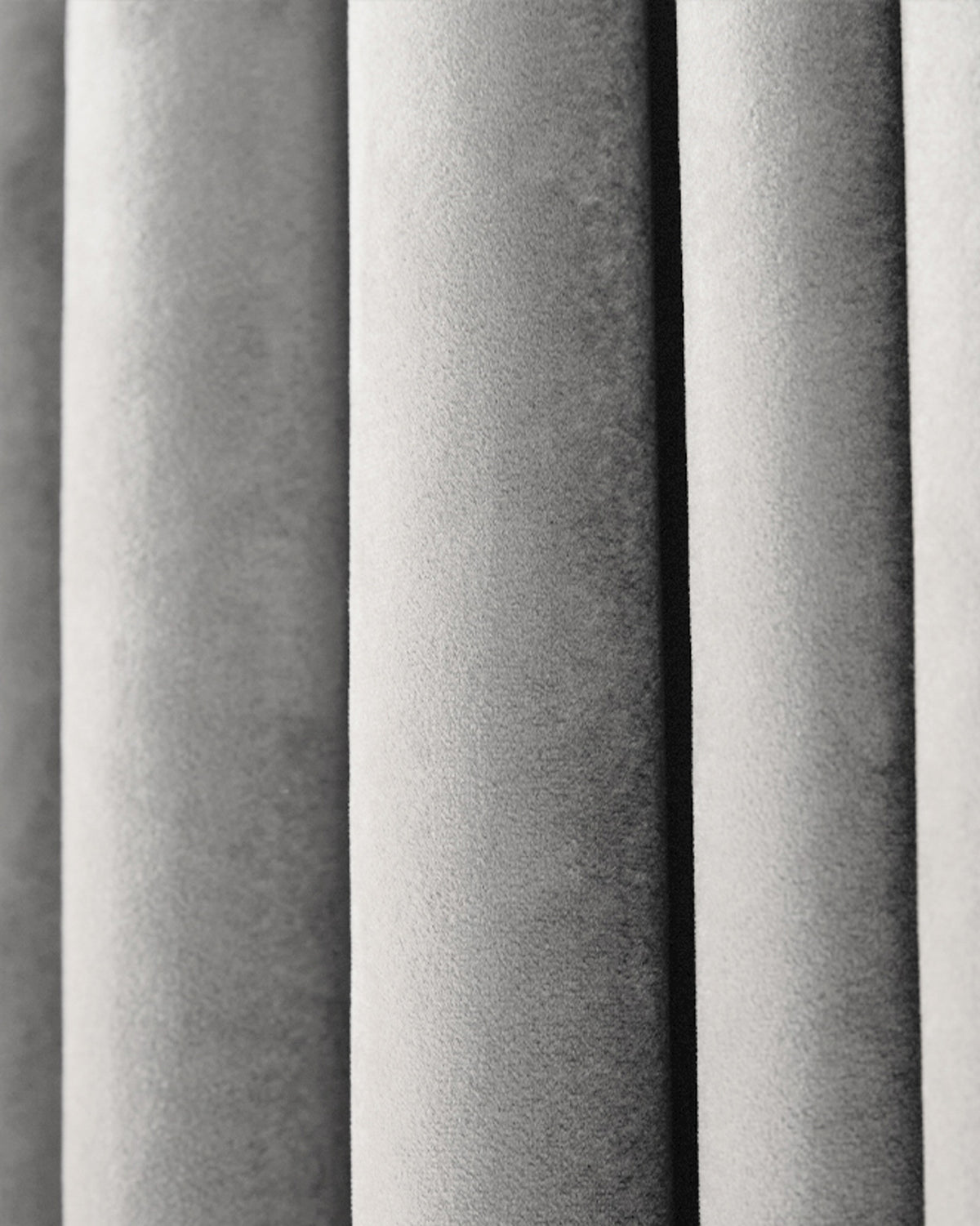 Luxurious Moonlit Velvet custom curtain close-up, highlighting plush silver-grey fabric texture and soft pleats.