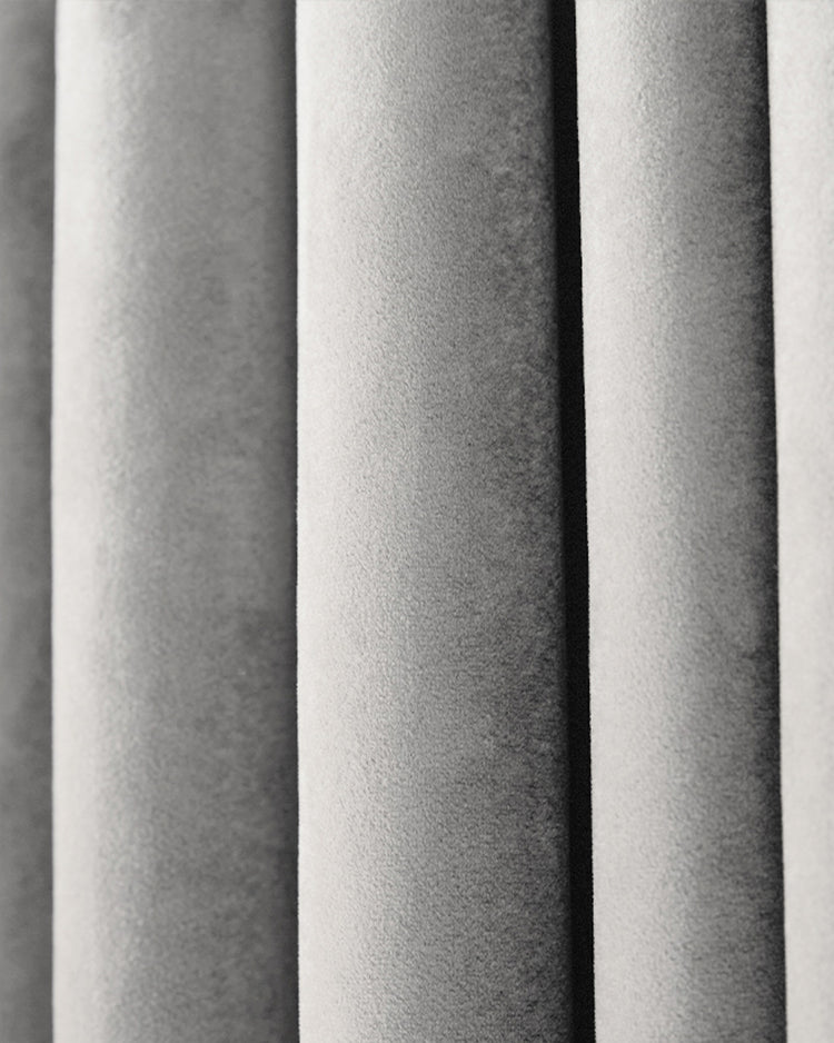 Luxurious Moonlit Velvet custom curtain close-up, highlighting plush silver-grey fabric texture and soft pleats.