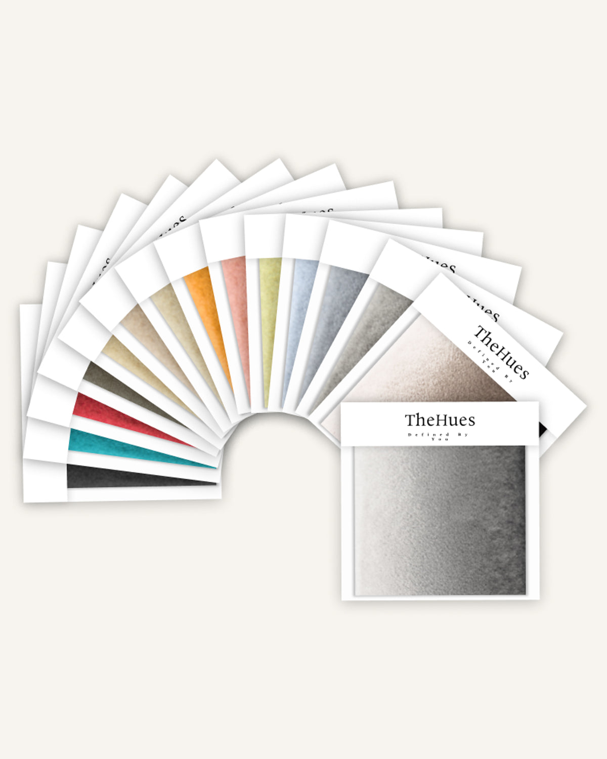 TheHues Moonlit fabric swatches arranged in a fan, showcasing a variety of colors and textures for custom window treatments.