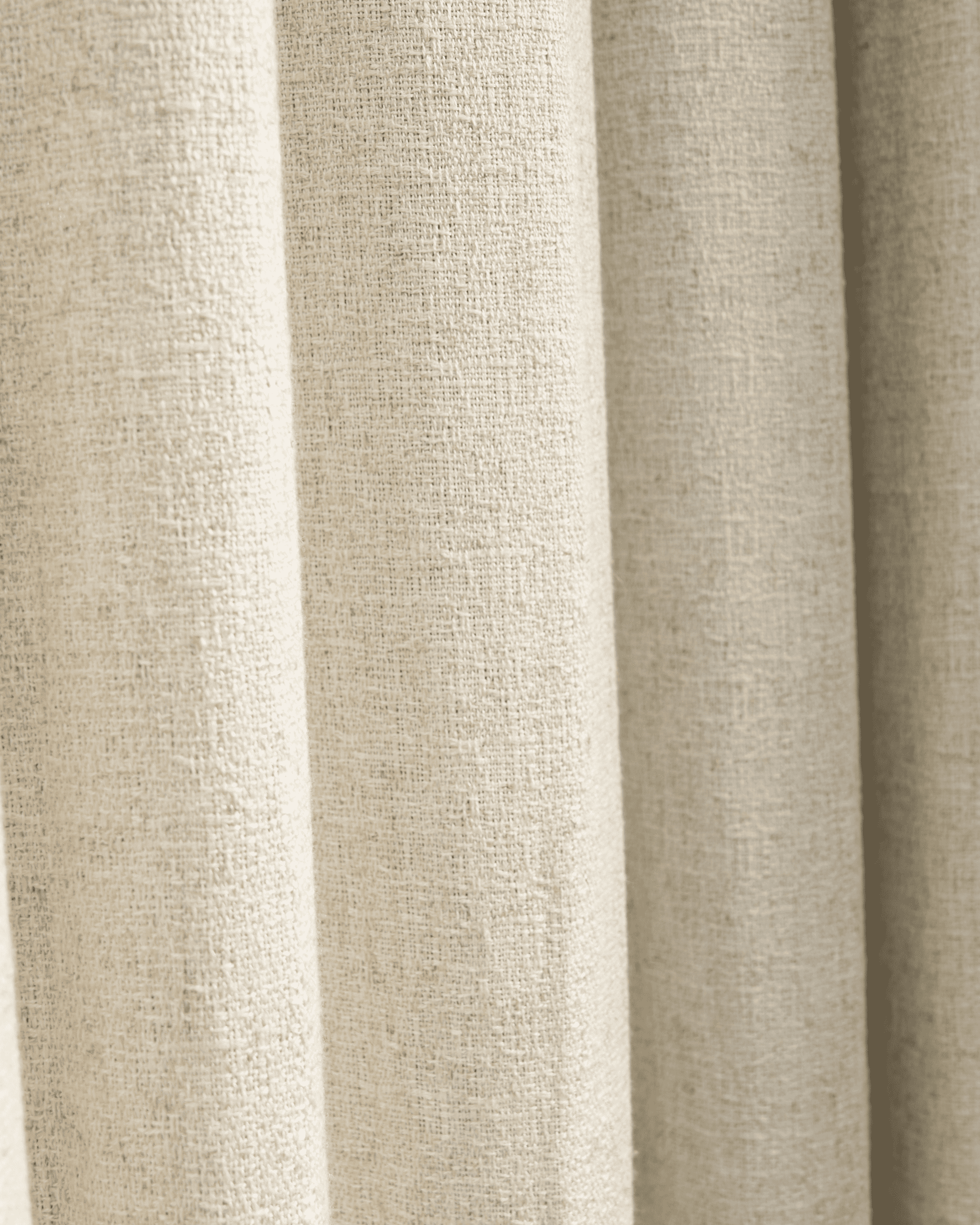 Close-up of the Fiona linen blend custom curtain fabric, showcasing its natural textured weave and elegant, soft drape.