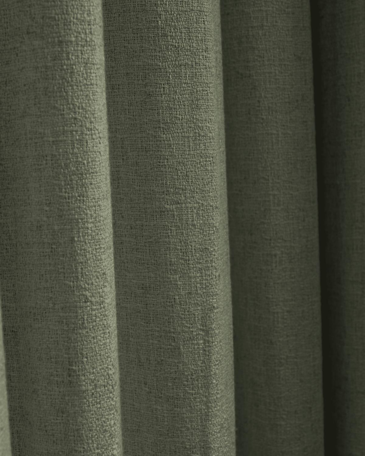 Detailed view of Fiona green linen blend custom curtain fabric, showing its luxurious texture and soft, elegant drapery folds.