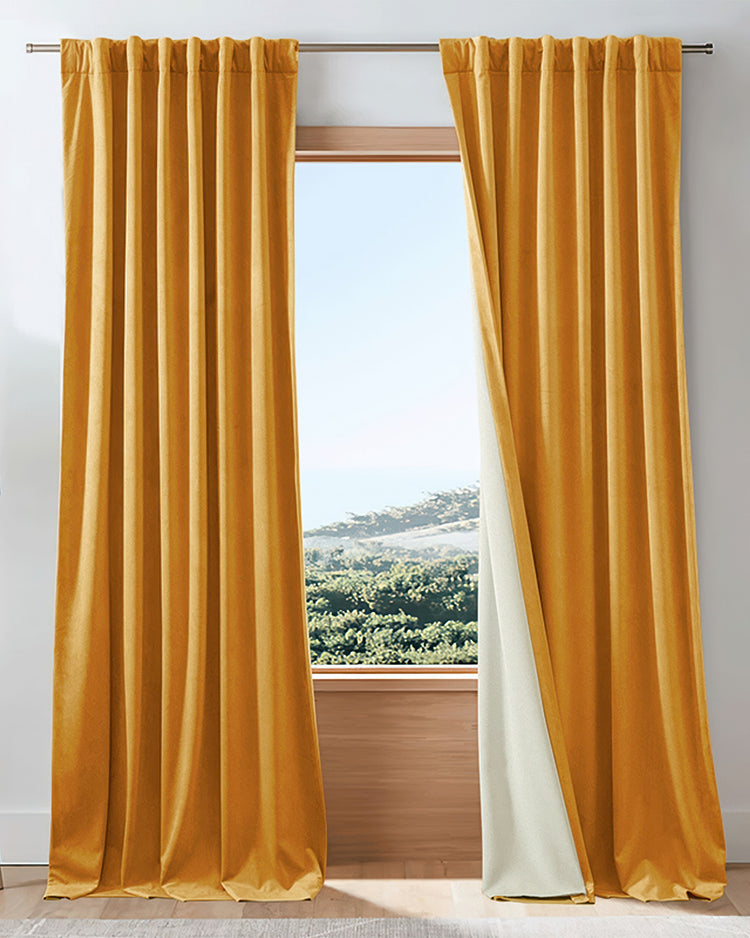 Elegant golden velvet custom curtains with full thermal blackout lining, providing soundproof privacy.