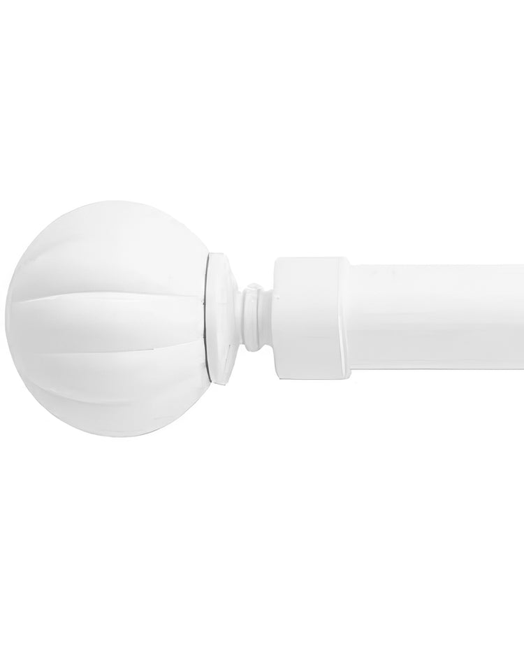 White reeded ball finial on an adjustable curtain rod for high-end home decor window treatments.