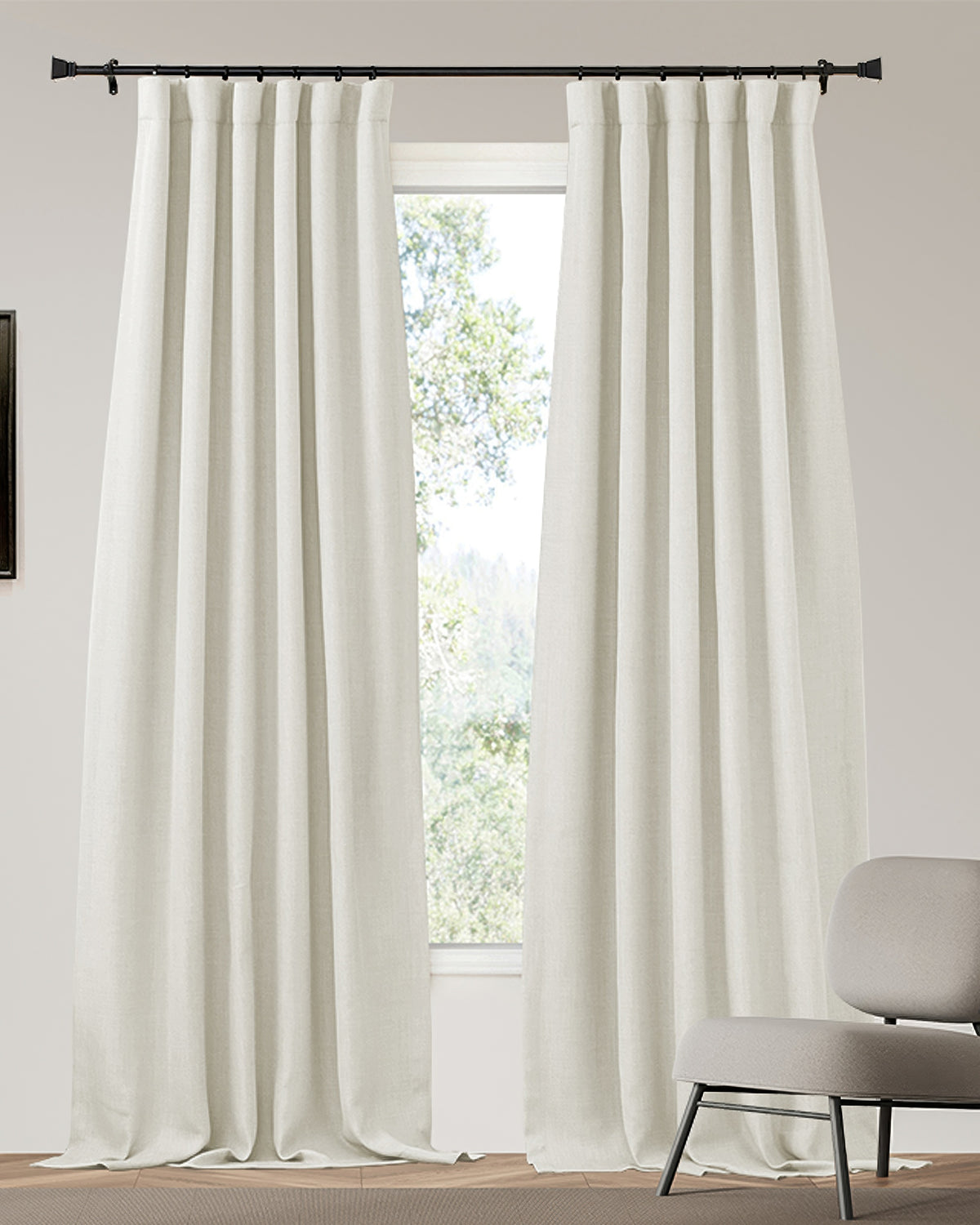 Off-white Zoe custom 4-layer linen look blackout curtains, heavyweight, thermal, & soundproof, gracefully hanging in a bright room.