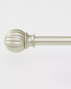 Detailed view of a brass adjustable curtain rod with a decorative ribbed finial for luxury window treatments.