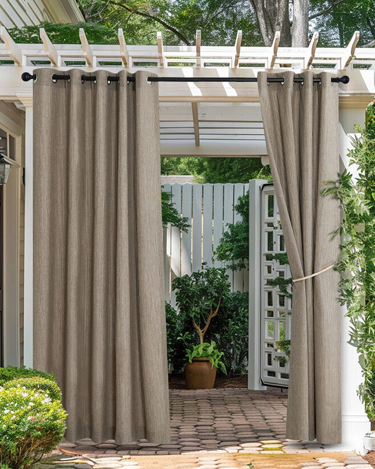 High-performing fade-resistant waterproof textured beige outdoor curtains with grommets on a pergola for patio privacy.