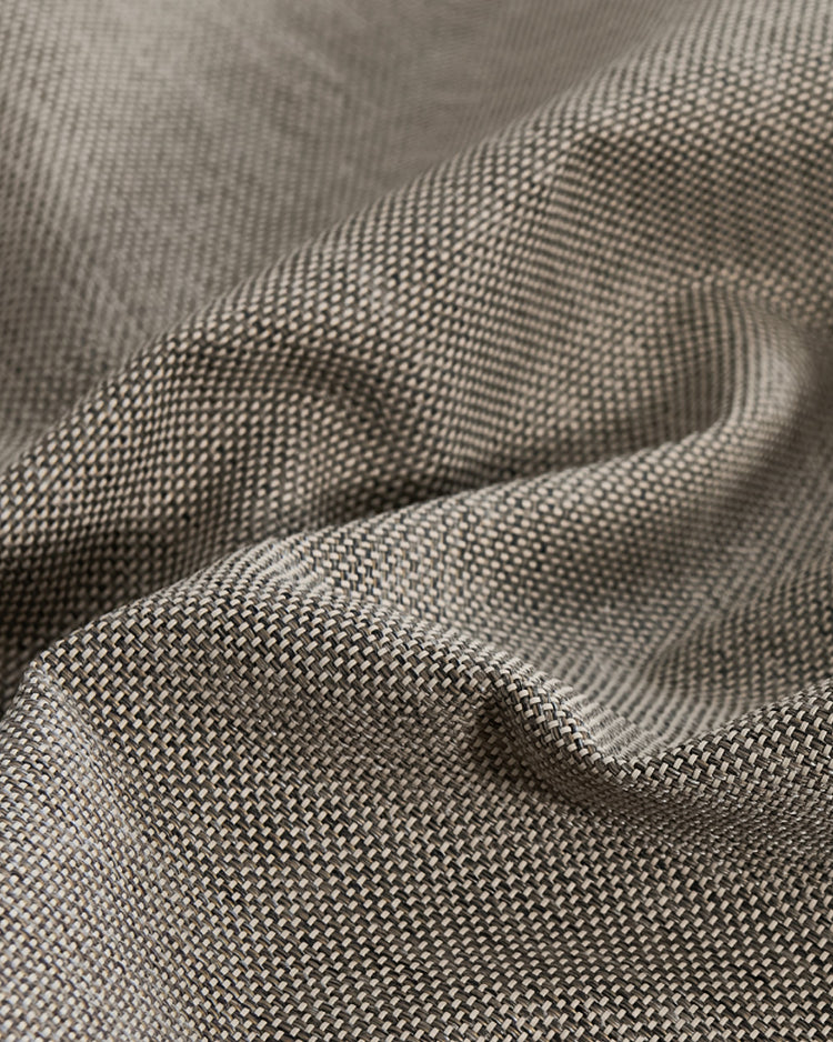 Close-up showing the textured, two-tone weave of Boston high-performing custom outdoor curtain fabric; fade-resistant, waterproof.