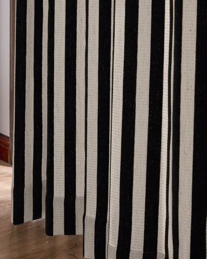 Textured Liam custom linen blend curtain featuring bold vertical black and off-white stripes, showcasing the fabric detail.
