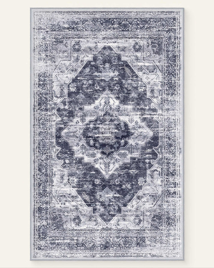 Diana's Garden denim blue washable area rug with a distressed traditional medallion pattern in faded white and blue