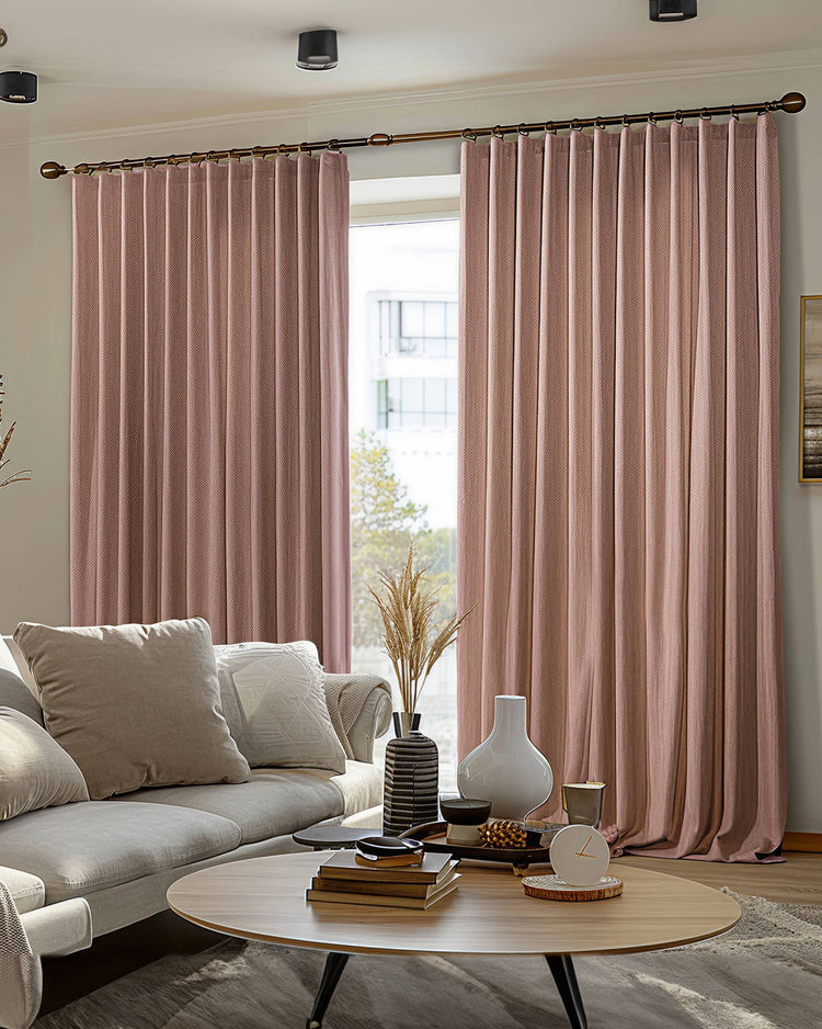 Florence textured rose 100% blackout custom drapery providing thermal & soundproof privacy in a stylish living room.