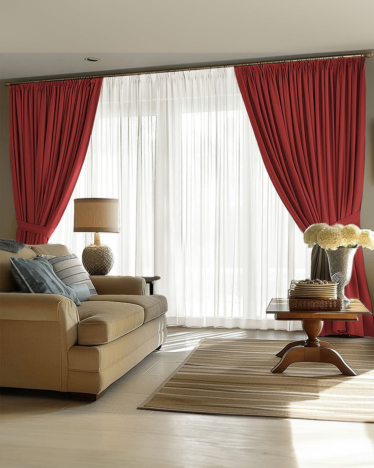 Victoria custom heavyweight deep red blackout linen drapes, tied back with sheers in a sunlit living room, offering thermal privacy.