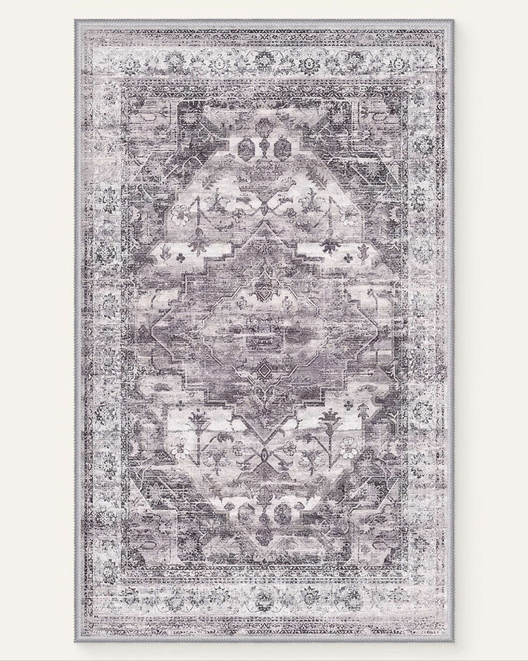 Diana's Garden Gull Gray washable area rug showcasing a distressed vintage floral medallion design in soft white and gray.