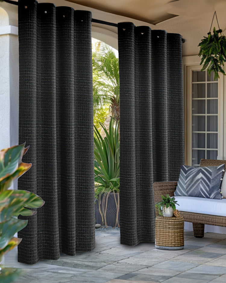 Dark gray New York Grid Patterned textured waterproof custom outdoor curtains on a sunny patio, perfect for privacy and sun protection.
