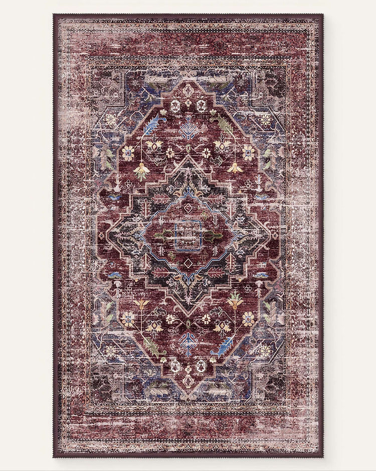 Diana's Garden washable rug: distressed burgundy, blue, gold traditional floral medallion pattern, evoking a fantasy garden.