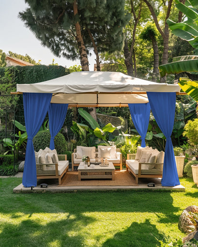 Blue FadeShield canvas custom outdoor curtains tied back on a gazebo, creating a luxurious private patio lounge.