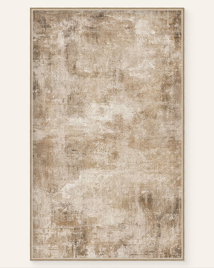 Warm beige Mystic Clouds washable area rug with a faded, abstract pattern, blending natural and mystical motifs.
