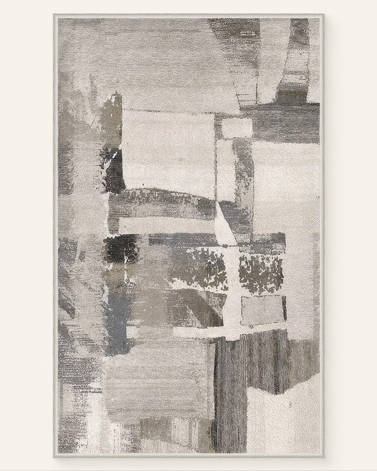 Geometric Vintage Tara washable area rug with abstract grey, white, & beige distressed pattern.