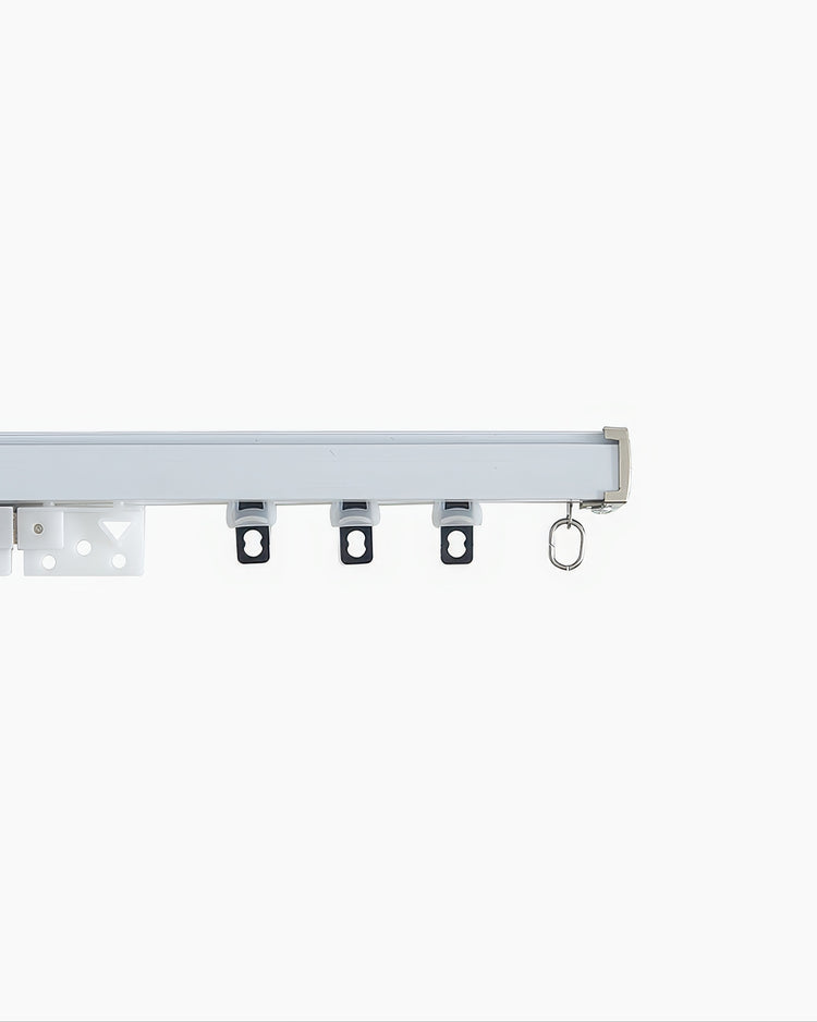 High-end custom heavy-duty metal curtain track with magnetic closing, featuring gliders for substantial drapery panels.