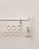 White Roman Square custom finials curtain rod with mounting brackets and six matching curtain rings for tailored window treatments.