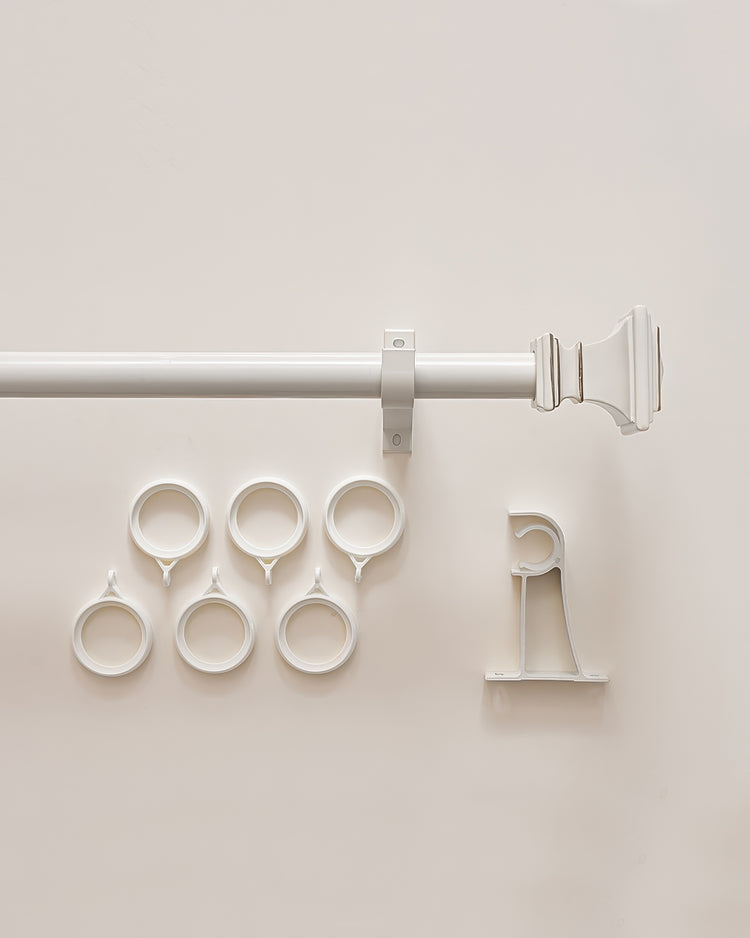 White Roman square custom curtain rod set with decorative finial, mounting bracket, and six matching drapery rings