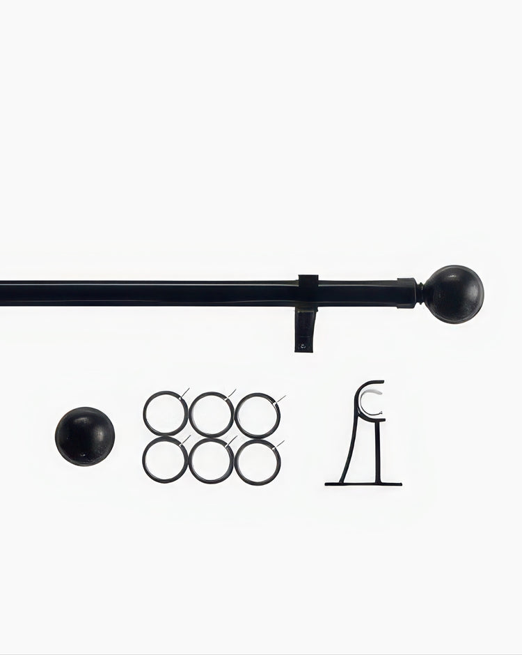 Black Roman round custom finial curtain rod set with a matching sphere finial, six drapery rings, and wall bracket.