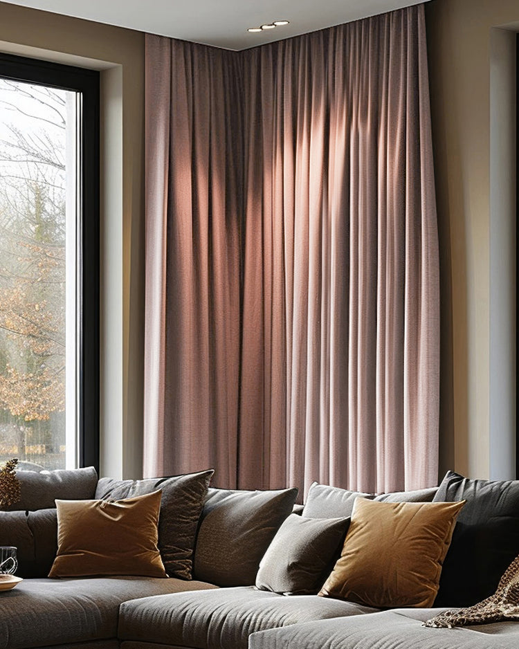 Florence 100% blackout custom curtains, muted woven texture, covering a corner window for privacy and light control.