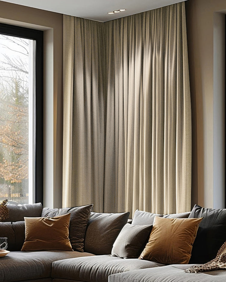 Florence warm beige heavyweight woven textured blackout custom curtains drawn for privacy & light control in a sophisticated living room.