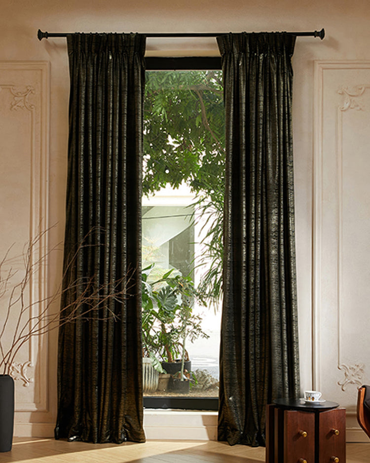 Dark Rome Foil Printed Velvet custom curtains on a black rod, enhancing a luxurious window with green garden view and elegant decor.