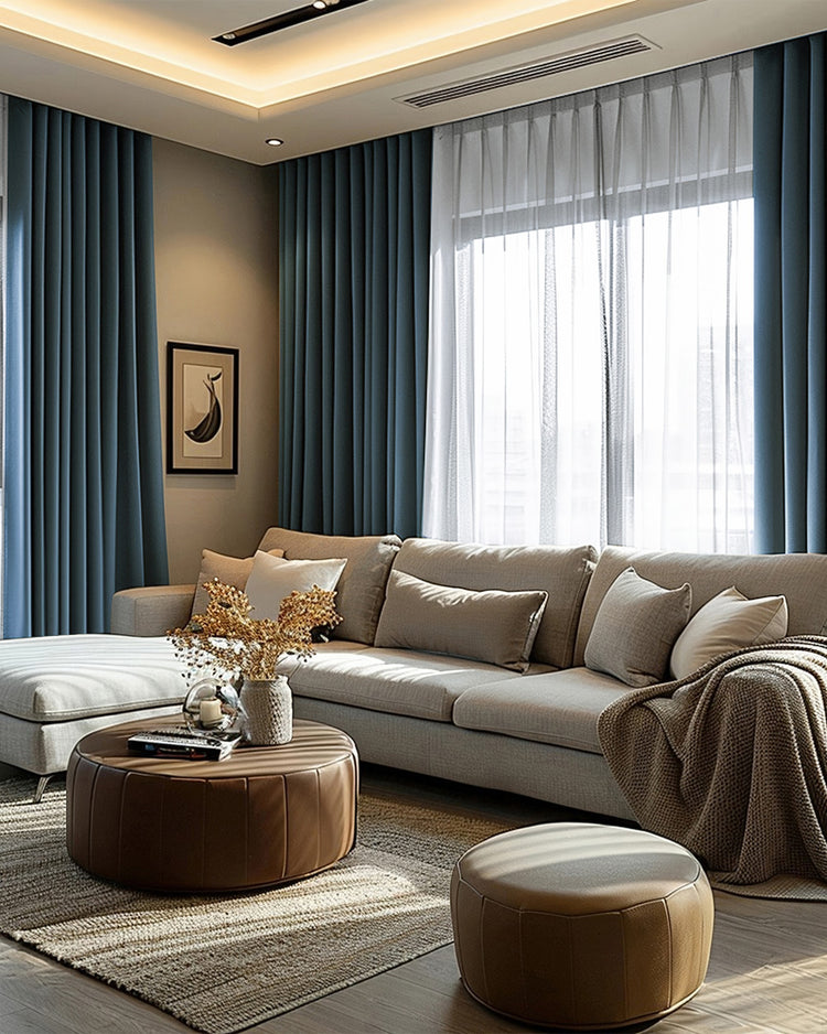 Modern living room with custom teal linen 100% blackout curtains, layered with sheer drapes for light control & privacy over a large window.