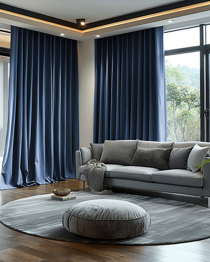 Rich navy velvet custom curtains in a modern living room, offering 100% blackout, soundproof, and thermal insulation.
