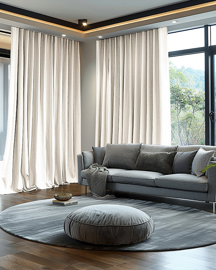 Sophisticated living room with light beige Quinn 4-layer heavyweight velvet custom blackout curtains providing soundproof, thermal, and light control.