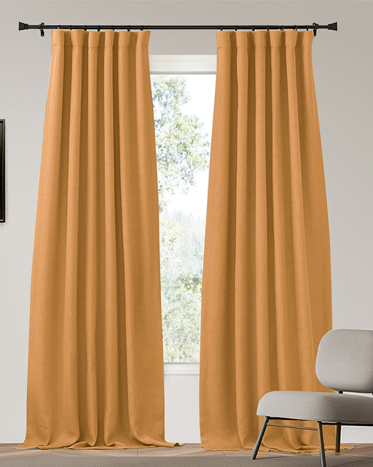 Zoe heavyweight custom blackout curtains in rich amber linen-look fabric, providing elegant privacy & light control.