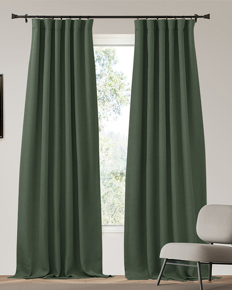 Deep green custom blackout curtains in heavyweight, 4-layer linen-look fabric. Designed for thermal insulation & soundproofing, pooling on floor.