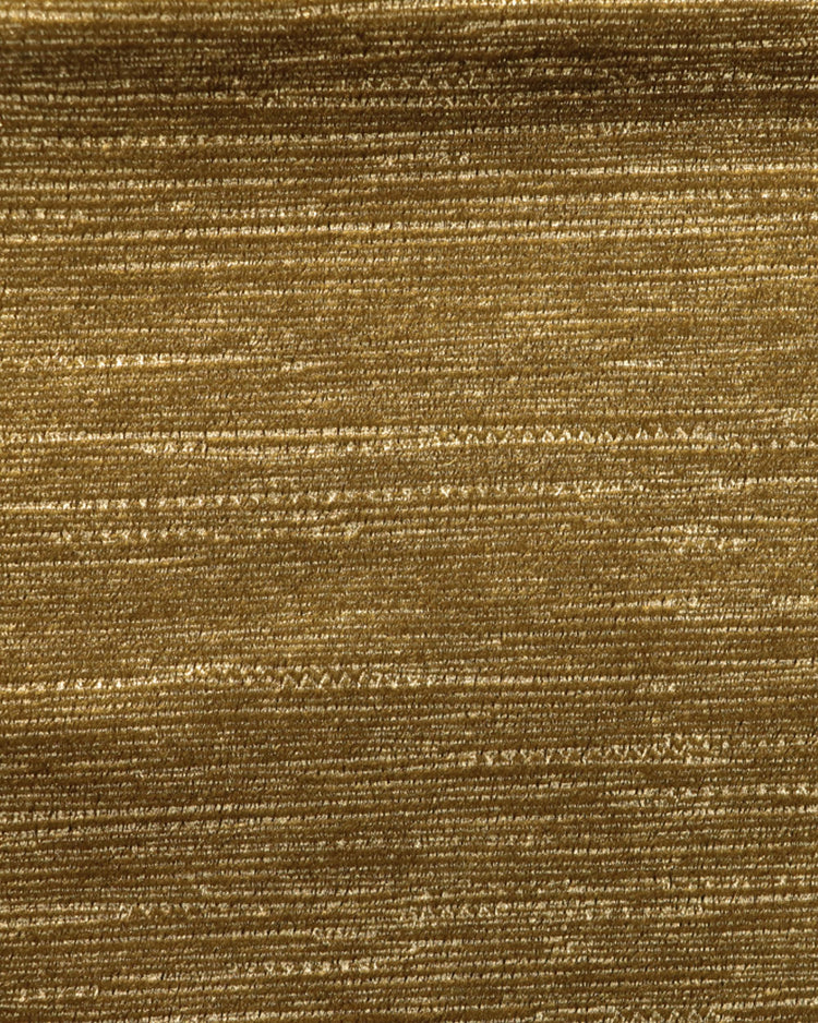 Close-up of golden Rome Foil Printed Velvet fabric with subtle shimmering horizontal texture for custom luxury drapery and window treatments.