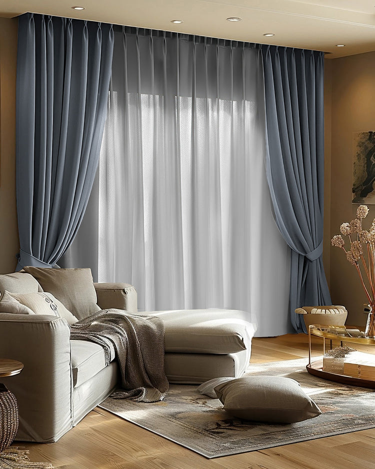 Deep blue-gray Quinn Blackout Velvet custom curtains, track mounted & tied back, layered with sheers.