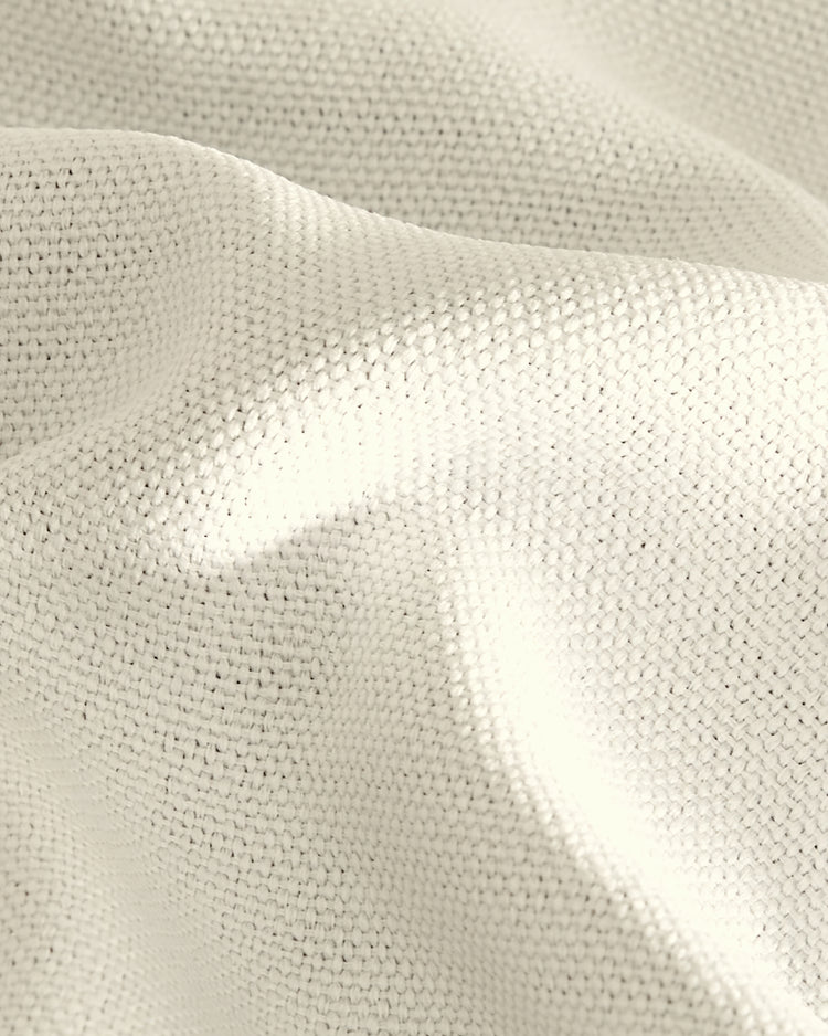 Macro view of soft, textured Zoe linen look fabric, showing its elegant weave and gentle drape for custom curtains.
