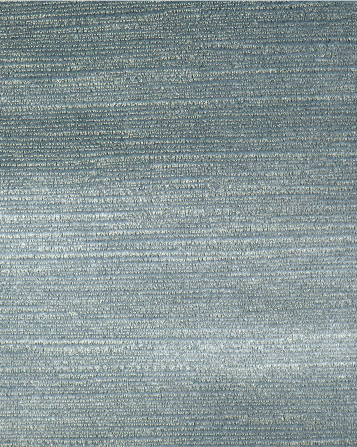 Close-up of luxurious blue Rome foil printed velvet custom curtain fabric, showcasing its shimmering horizontal texture for elegant window treatments.