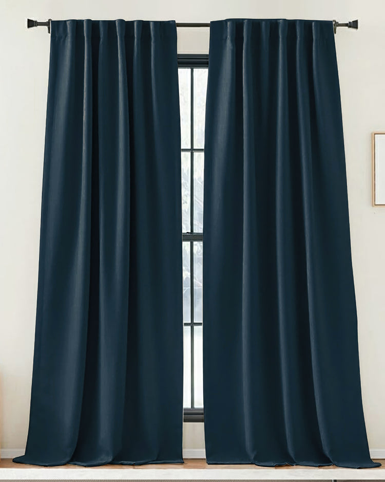 Deep blue Zoe linen-look custom drapery panels, tailored with soft folds, providing sophisticated light control & privacy for home decor.
