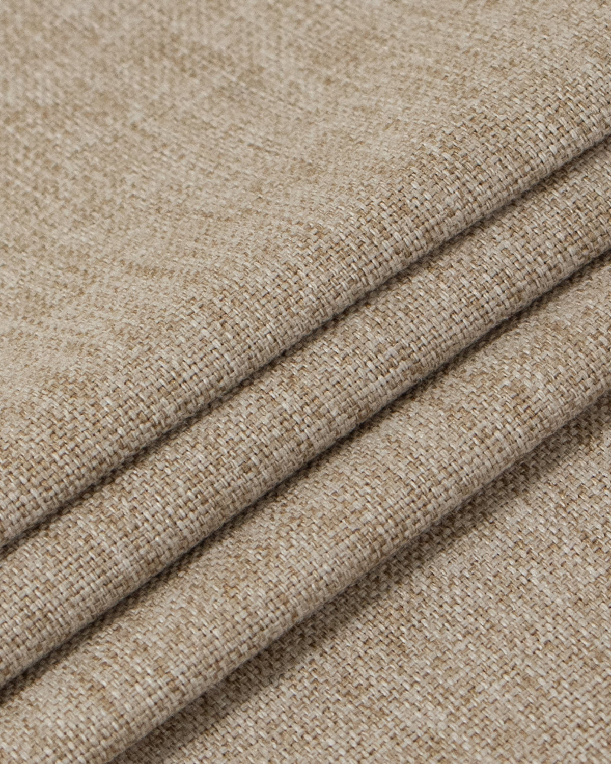 Natural beige linen-look heavyweight fabric, intricately woven, folded to showcase texture for Victoria blackout custom curtains.