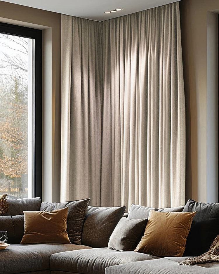 Florence heavyweight custom blackout curtains, woven textured beige drapes on a corner window in a modern home.