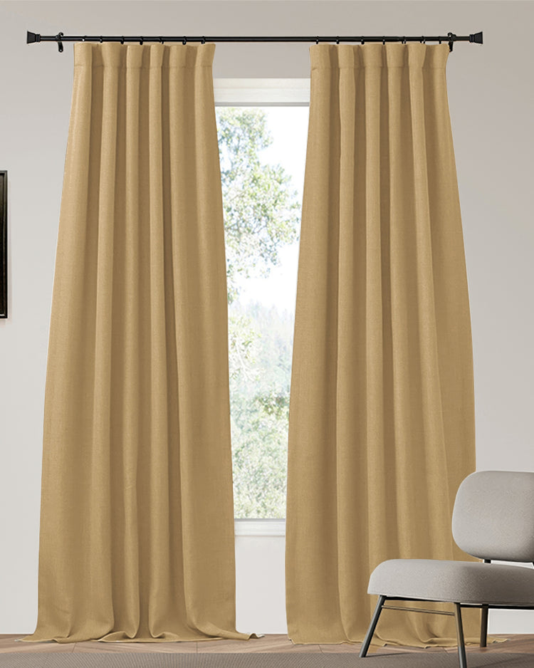 Zoe custom 4-layer linen-look heavyweight thermal blackout drapery in a warm tan, with pleated header, perfectly balancing privacy.