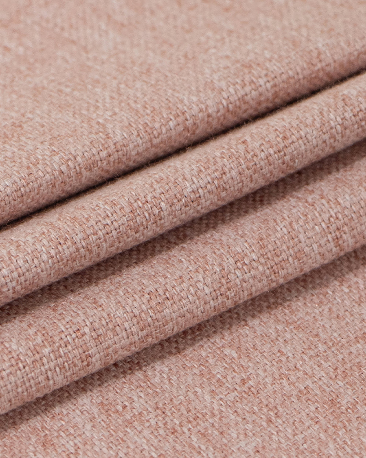 Close-up of folded Victoria 100% blackout, OEKO linen look heavyweight curtain fabric with visible weave, in a warm rose brown.