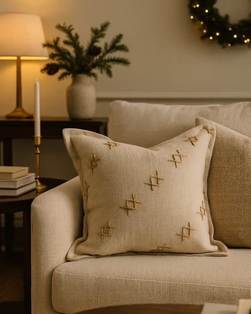 Elegant Arden textured yarn stitched throw pillowcase with decadent cross-patterned details on a neutral sofa. High-end home decor.