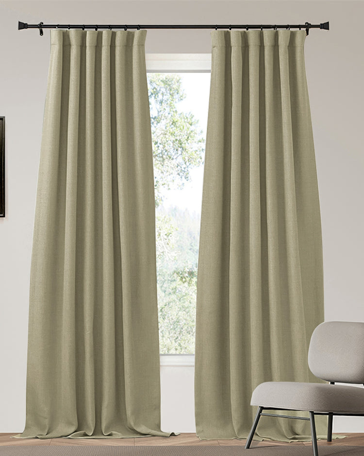 Zoe custom heavyweight beige linen look 100% blackout curtains with pleated header on a black rod for optimal light control.