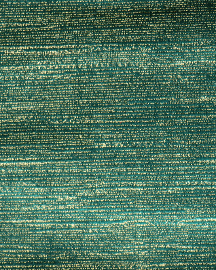 Close-up of Rome custom curtain fabric. Deep teal velvet with shimmering gold foil print in horizontal textured lines.