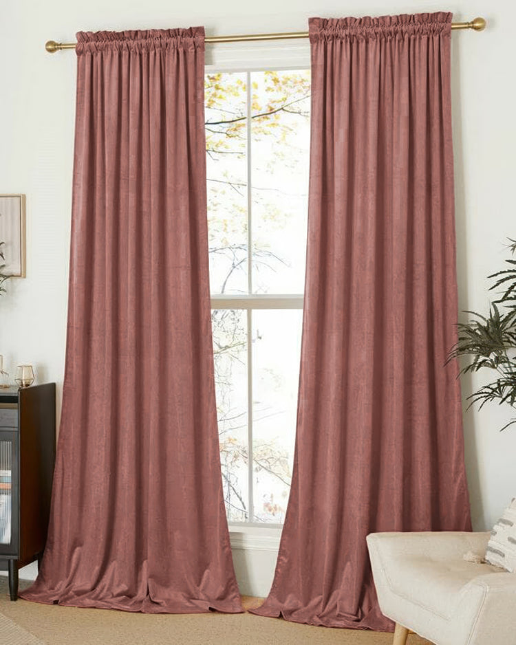 Classic dusty rose velvet custom curtain pair with elegant rod pocket header on a gold rod, pooling for luxury home decor.