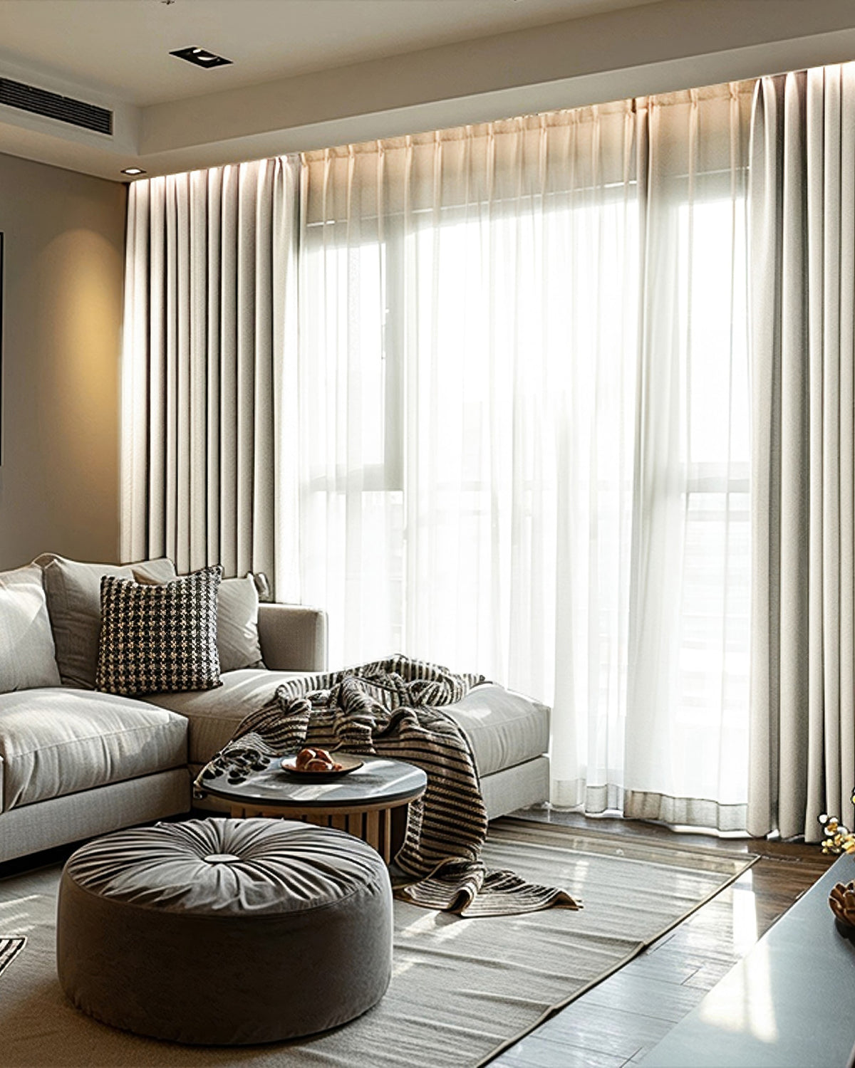 Light taupe Cronin Linen Look Blackout Custom Curtains & sheer drapery in a sunlit modern living room, balancing privacy & light control.